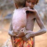 Somalia_Famine_Girl_Carrying_Baby